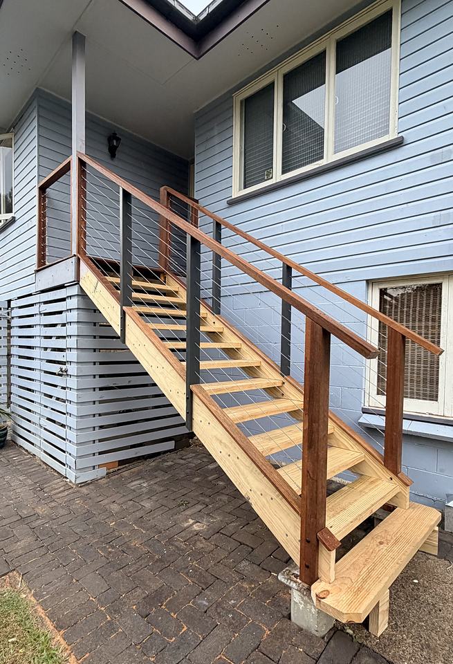 Timber stair with hardwood handrail, wire balustrade and slatted under-house screening